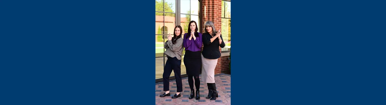 View of Desktop with Computer Keyboard and Phone